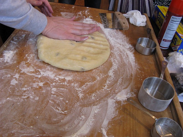 Degassing the dough.